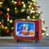 Juleby, tv med lys og musikk